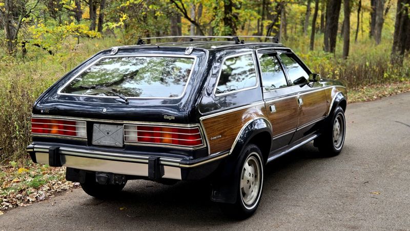 Rear three-quarter view with the AMC and Eagle badges, the 4 Wheel Drive script and the tow hitch