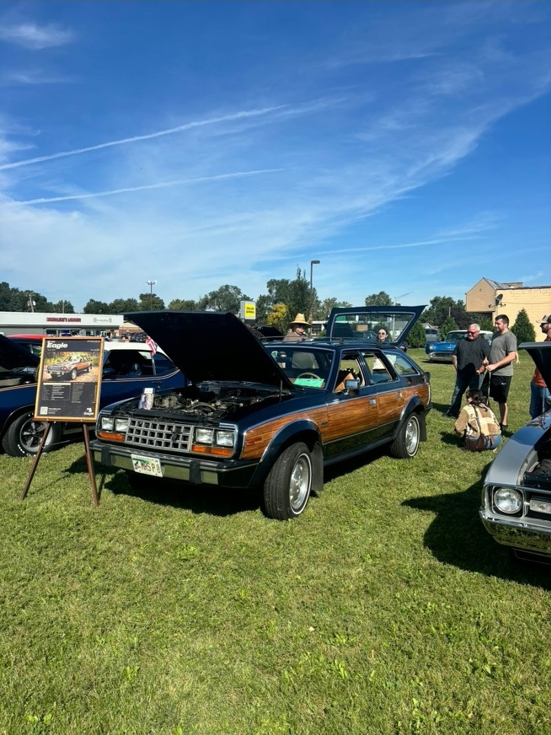The Eagle on the show field with its hood up and the Rare Bird poster on an easel beside it